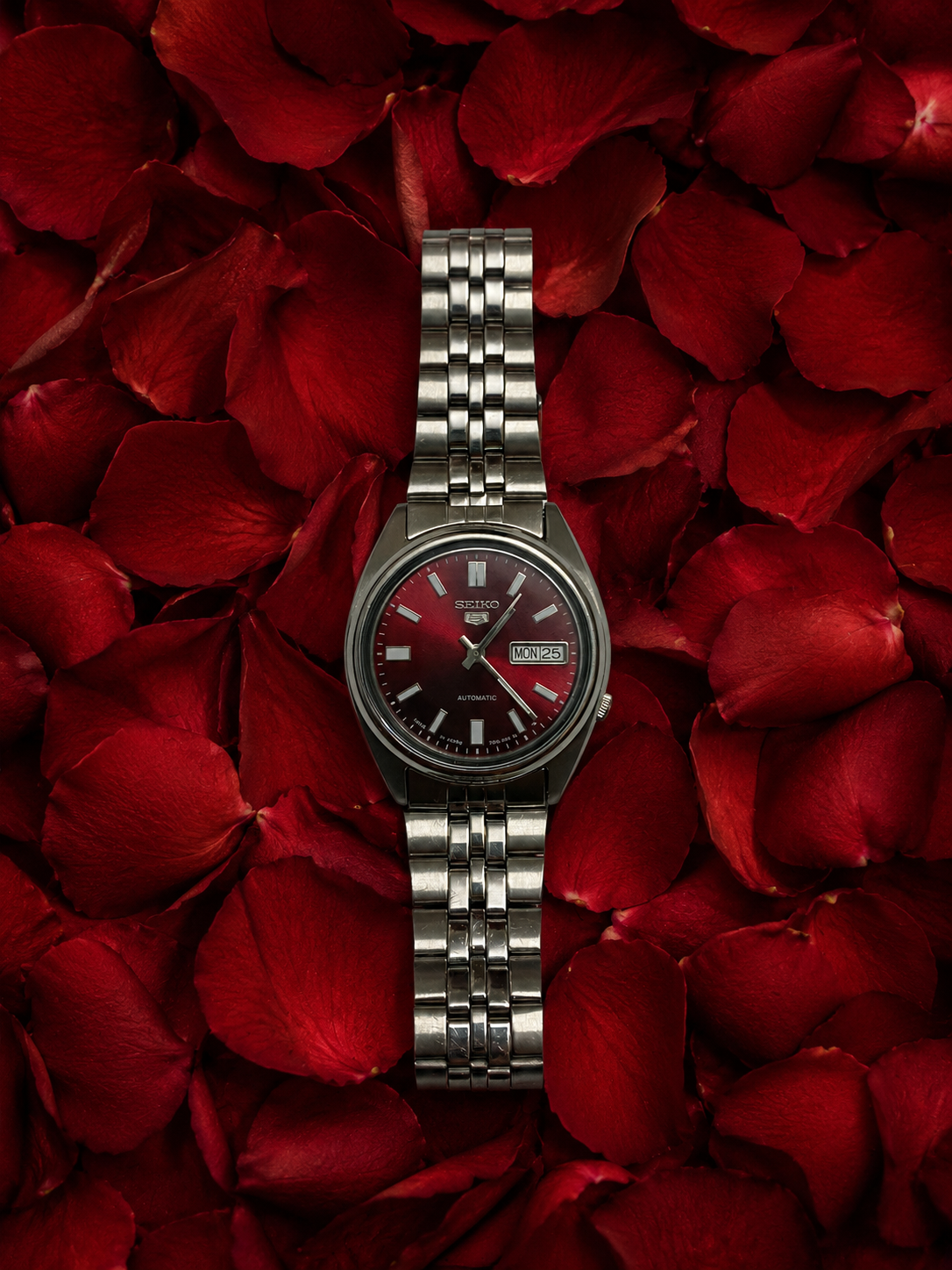 Seiko 5 men's automatic watch with black dial, stainless steel case, and classic everyday design